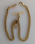 An 18ct yellow gold flat curb-link Albert chain with T-bar and twin lobster clasps, 38 cm, 63g