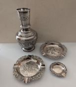 A mid-century Indian silver baluster vase with etched and embossed decoration, cartouche filled