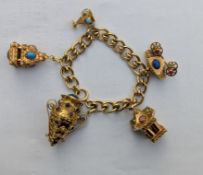 A yellow gold curb-link charm bracelet, each link stamped 18ct, 20 cm and five larger charms