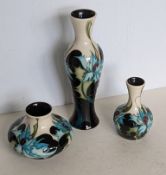 A Moorcroft 'Sea Holly' pattern baluster vase, bud vase and squat vase, all designed by Emma Bossons