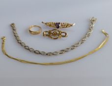 An 18ct yellow gold buckle ring, size L, 1.6g, two 9ct yellow gold brooches and two bracelets