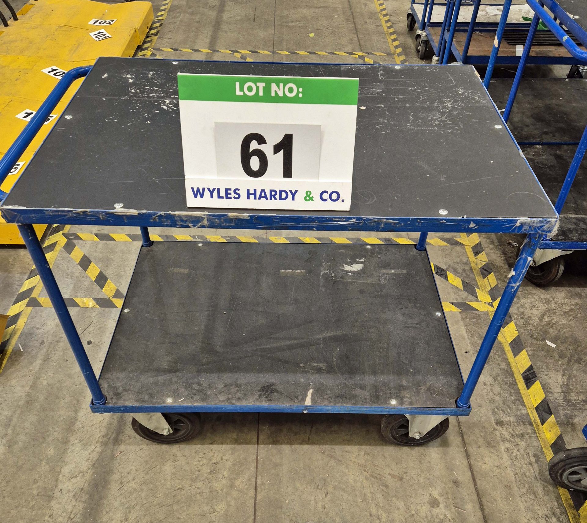 A Blue Steel Framed 2-Tier Trolley, 870mm tall x 700mm wide x 1000mm long with fitted Two Steering