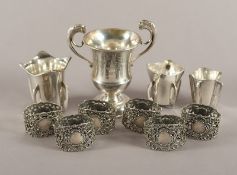 drei Becher, ein kleiner Pokal und sechs Serviettenringe, 835-925/ooo, 20.Jh.
