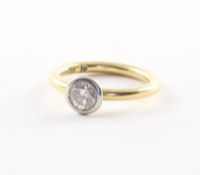 Solitärring, 585/750/ooo WG/GG, Brillant von ca. 0,79 ct., W p1, 5,3g
