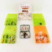 Collection of fly fishing lures in cases