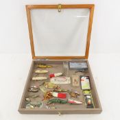 Vintage fishing lures in display case