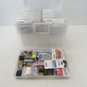 HO model train accessories in plastic organizers