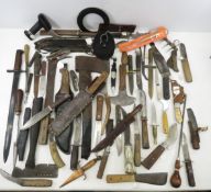 Collection of vintage knives, axes, and more