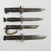 Four US WW2 fighting knives. No scabbards