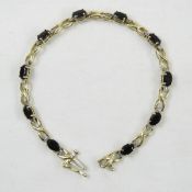10kt Gold, Garnet & Diamond Bracelet 7