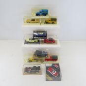 11 diecast cars in plastic display cases
