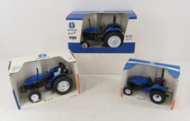 3 New Holland 1/16 Scale Die Cast Tractors in Box