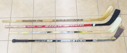 4 left handed hockey sticks- 1 signed Toomey