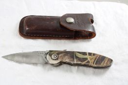 Buck 297 Assisted Open Folding Knife in Sheath