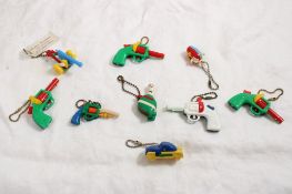 Bag of Figural Puzzle Key Chains -SCHMOO, Canon