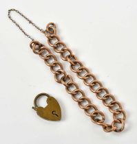 A rose metal curb link bracelet, stamped '9C', approx 8.7g, and a brass padlock clasp.