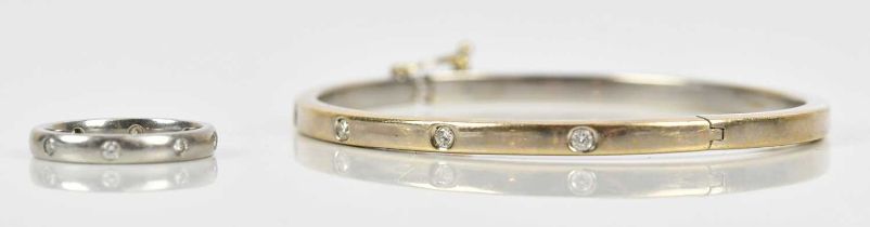 An 18ct white gold diamond set snap bangle, approx 27.86g, with matching platinum ring, size M,