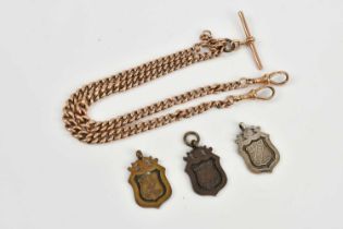 A 9ct yellow gold curb link Albert chain with 9ct gold T-bar, approx 37.2g, and three fob medals