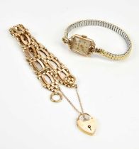 A 9ct yellow gold gate link bracelet with padlock clasp, approx 16.9g, and a lady's 9ct gold cased
