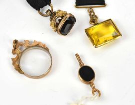 A Victorian gold plated fob seal with amethyst set stone, a similar later example set with a citrine