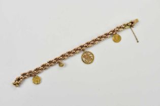 A yellow metal curb link bracelet, clasp stamped 15, set with a yellow metal coin, and three