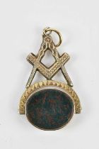A yellow metal Masonic swivel fob set with hardstone oval cabochons, stamped '9C', length 45mm,