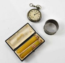 A boxed set of two amber coloured cheroot holders with yellow metal mounts, a hallmarked silver
