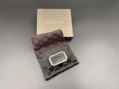 GUCCI, polished stainless steel and monogrammed leather inset money clip,