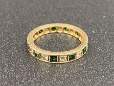 A green and white paste set, 9ct gold, Eternity ring,