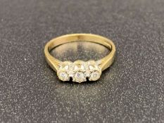 A Diamond set, three stone, 9ct gold ring with deceptive mount