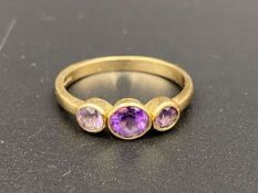 An Amethyst set, three stone, 9ct gold ring