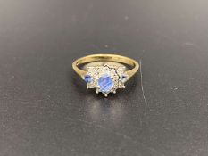 A Saphire and Diamond set, 9ct gold cluster ring,
