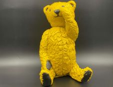 “ALL PROCEEDS TO CHARITY”. A modern cast resin model of a Teddy Bear,