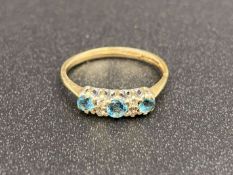 A Topaz and Diamond set, three stone, 9ct gold ring