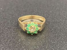 An Emerald and Diamond flower head, 9ct gold ring,