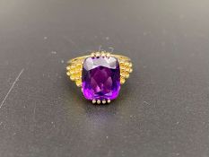 An Amethyst set 9ct gold ring