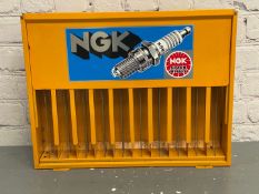 NGK, a modern painted steel, wall mounted spark-plug dispenser,