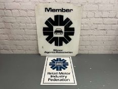 Two Plastic Motor Agents Association Signs