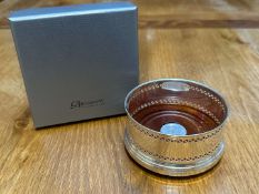 BROADWAY & Co, an Elizabeth II hallmarked silver and mahogany bottle coaster&nbsp;