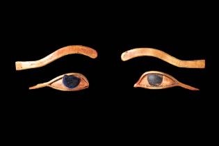 MATCHED PAIR OF EGYPTIAN HIGH KARAT GOLD AND STONE-INLAID EYES FROM A MUMMY MASK