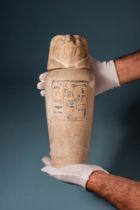 RARE EGYPTIAN LIMESTONE CANOPIC JAR WITH INSCRIPTION AND FALCON-HEADED LID