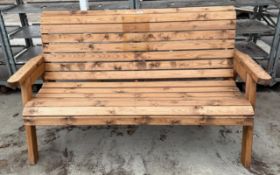 A LARGE WOODEN 3 SEATER BENCH +VAT