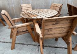 A WOODEN ROUND TABLE WITH 4 CHAIRS + VAT