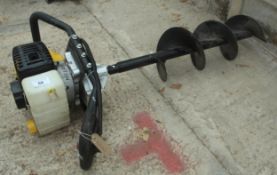 AN AUGER DRILL IN WORKING ORDER NO VAT
