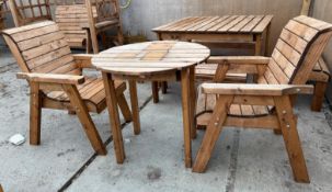 A SMALL WOODEN ROUND TABLE WITH 2 CHAIRS + VAT
