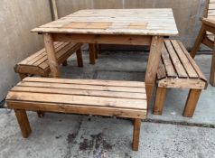 A WOODEN TABLE & 4 BENCHES + VAT
