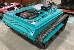 UNUSED REMOTE CONTROL CRAWLERLAWN MOWER MODEL 1010, GAS POWERED ,APPROX CUTTING WIDTH 39in