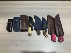 ( 8 ) UNUSED HANDMADE DAMASCUS KNIVES IN MOLD PROOF LEATHER SHEATHS, ASSORTED SIZES AND COLORS, S...