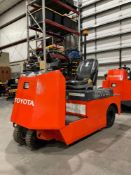 TOYOTA RIDE ON TUGGER MODEL CBT4, ELECTRIC, 48V, APPROX MAX DRAWBAR PULL 880LBS, NEEDS BATTERY