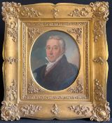 portrait of a gray-haired gentleman in a black suit